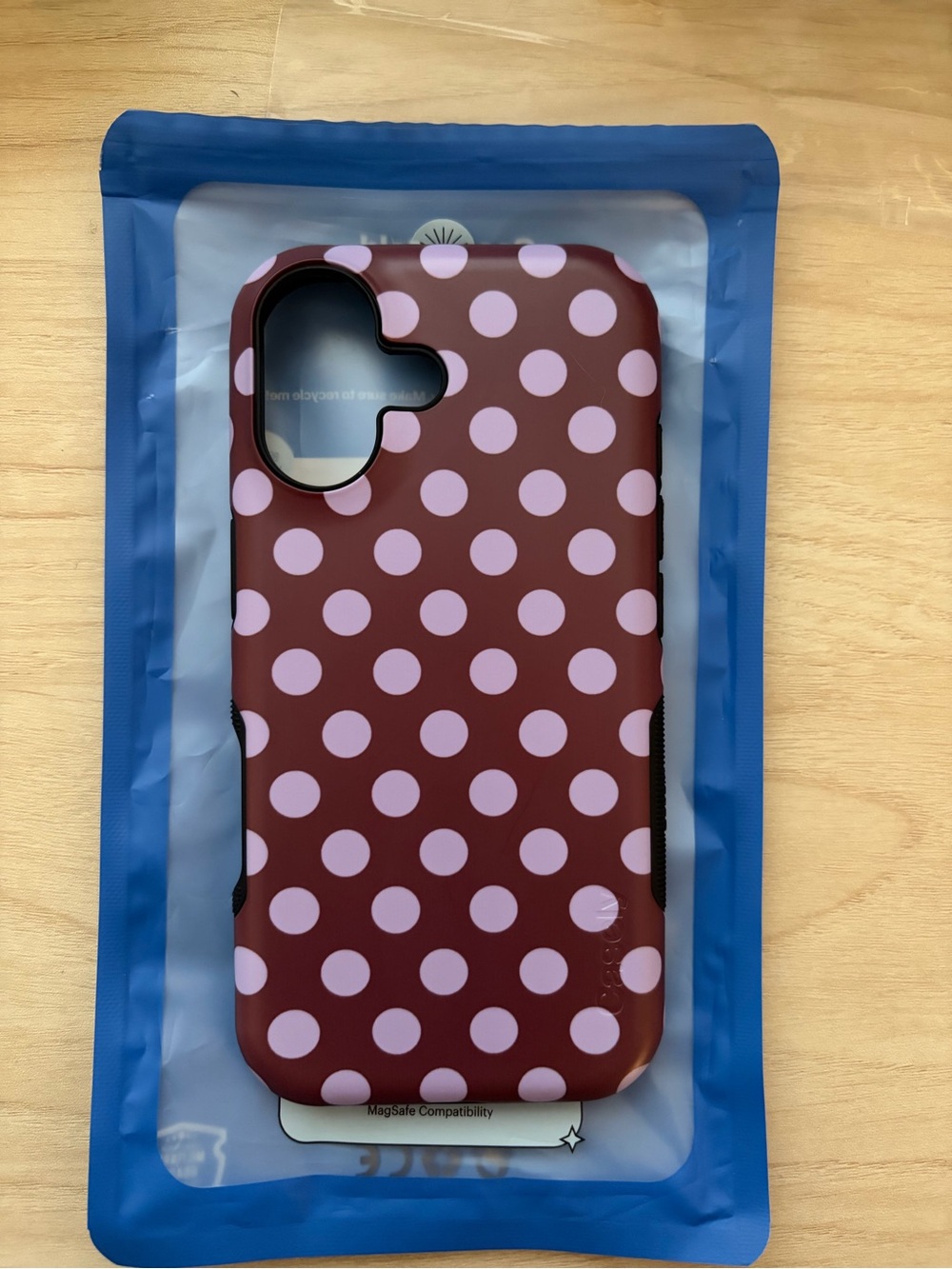 iPhone 17 spotted in SoHo- burgundy polka dot case